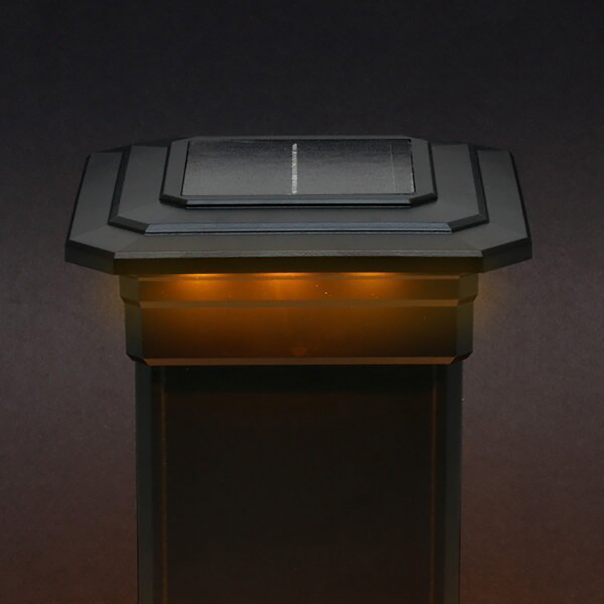 Solar-powered outdoor light on a dark background