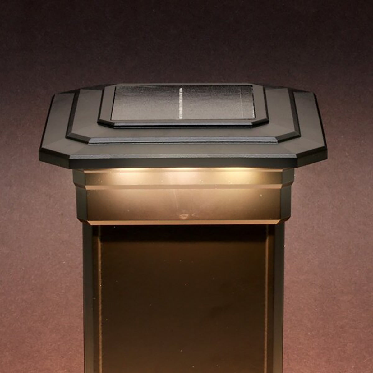 Solar-powered outdoor light fixture on a dark background