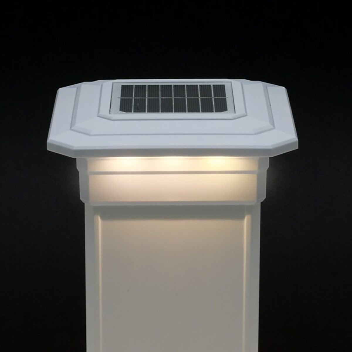Solar-powered outdoor light fixture on a black background