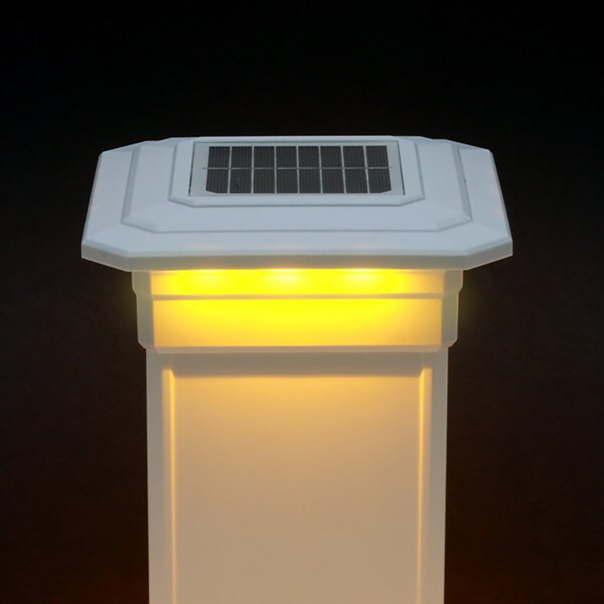 Solar-powered outdoor light fixture with a dark background