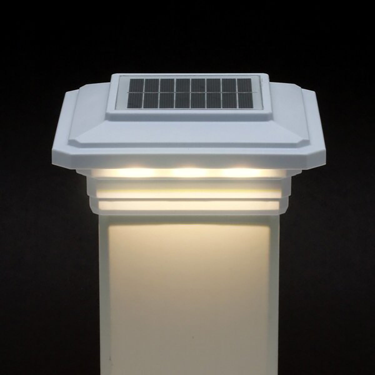 Solar-powered outdoor light fixture with a black background