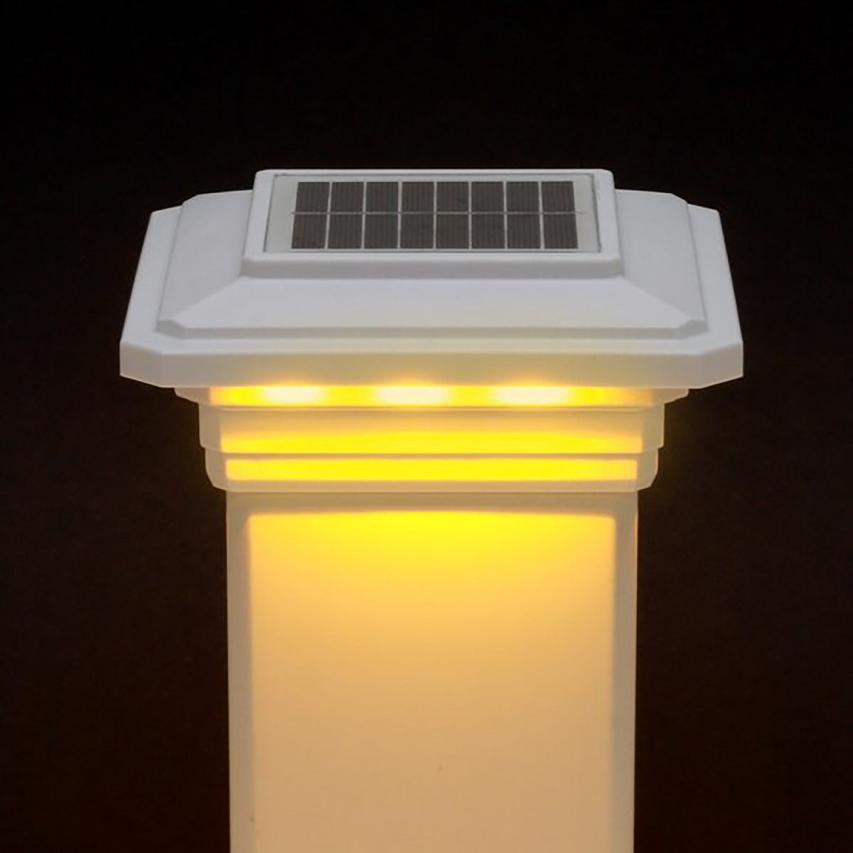 Solar-powered outdoor light fixture with a dark background