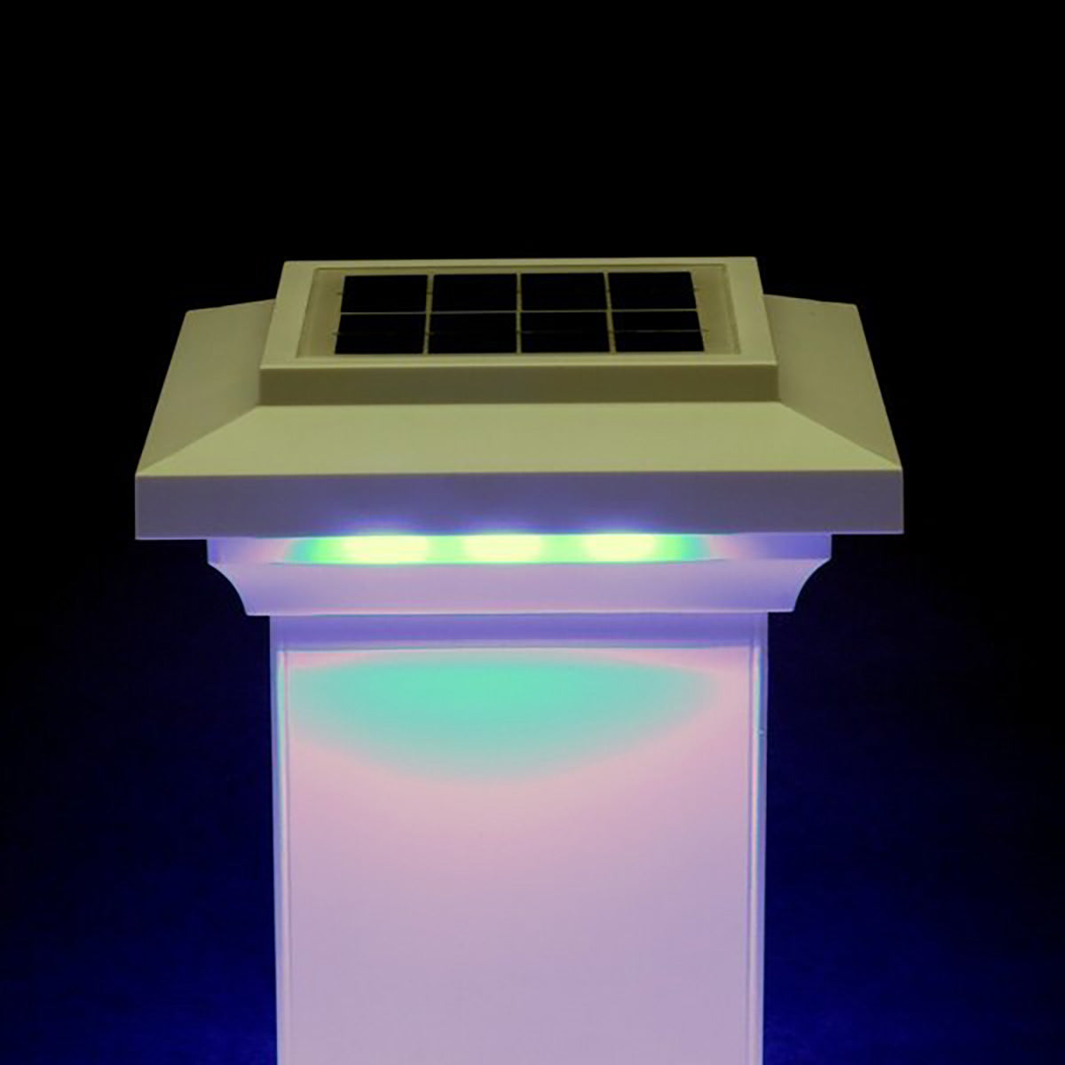 Solar-powered post light with colorful illumination on a dark background