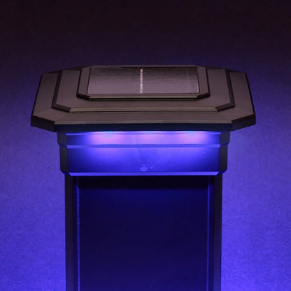 Solar-powered LED light post with blue glow on a dark background