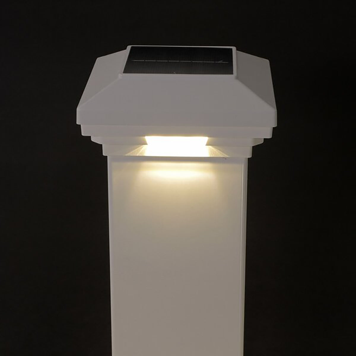 Solar-powered outdoor light fixture on a black background