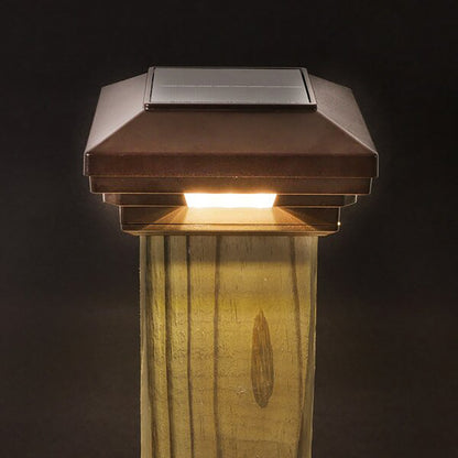 Solar-powered outdoor light fixture on a wooden post against a dark background