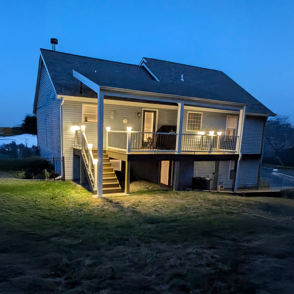 House with a lit porch at night