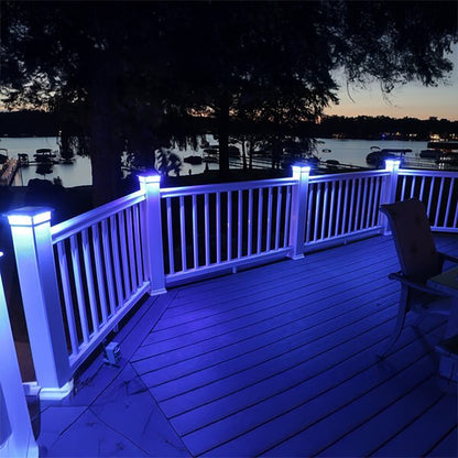 Deck with blue LED lights overlooking a lake at night